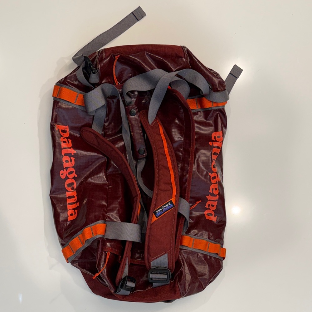 Patagonia Maroon Duffel Bag with Vibrant Orange Highlights